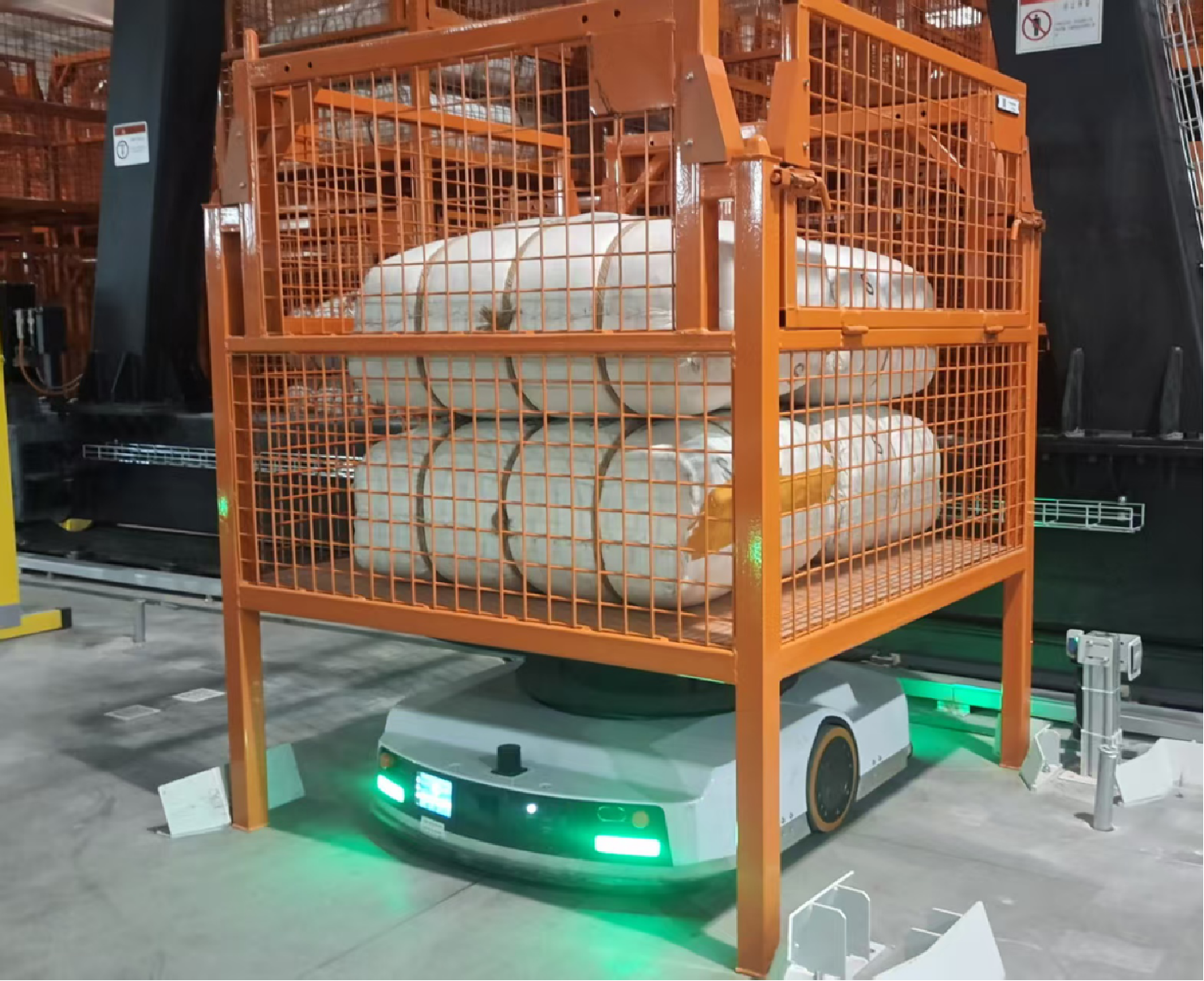AMR transporting caged goods in manufacturing